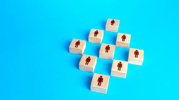 Figures,Blocks,Of,People,On,A,Blue,Background.,Concept,Of